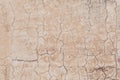 rotten dried and cracked plaster wall in the heat of India as harmonic background symbolizing age Royalty Free Stock Photo