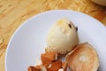 Rotten egg in white plate on wood background.