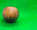 Rotten granny smith apple on green background Royalty Free Stock Photo