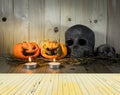 rotten Halloween pumpkin with candle light on Wooden background Royalty Free Stock Photo