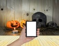 rotten Halloween pumpkin with candle light on Wooden background Royalty Free Stock Photo