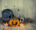 rotten Halloween pumpkin with candle light on Wooden background Royalty Free Stock Photo