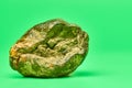 Rotten lemon, green background