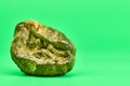 Rotten lemon, green background