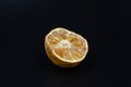 Rotten lime fruit on seen from above on a dark background Royalty Free Stock Photo