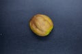 Rotten lime fruit on seen from above on a dark background Royalty Free Stock Photo