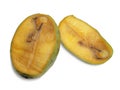 Rotten mango, sliced fruit showing wormholes inside, isolated cut out