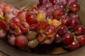 Rotten spoiled grapes on a plate
