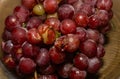 Rotten spoiled grapes on a plate