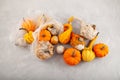 Rotten spoiled pumpkins in plastic bag on textured grey background. Ugly moldy vegetables. Improper food storage. Concept - Royalty Free Stock Photo