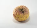 A Rotten and withered apple over a white background Royalty Free Stock Photo