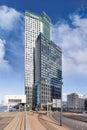 Modern office buildings against a blue sky with dramatic clouds, Kop van Zuid Rotterdam Royalty Free Stock Photo