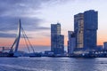 Daybreak view on the Erasmus bridge with illuminated buildings, Rotterdam, netherlands