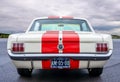 ROTTERDAM / NETHERLANDS - AUGUST 18 2019: Back view of a classic Ford Mustang 1965 on display at a classic car meeting Royalty Free Stock Photo