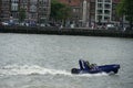 Blue Dutch harbour police patrol speed boat on the river Nieuwe Maas