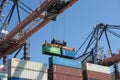 Containers being moved after being disembarked on a container terminal in the harbour