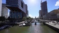 ROTTERDAM, NETHERLANDS - JUNE 9, 2022: Rotterdam cityscape with canal on sunny day, Netherlands