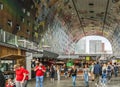 People inside the huge horseshoe-shaped Markthal Market Hall