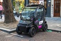 Modern electric car parked on the street. Tiny car