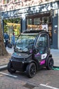 Modern electric car parked on the street. Tiny car