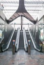 Modern escalators inside a futuristic station mall terminal Royalty Free Stock Photo