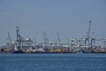 ROTTERDAM, THE NETHERLANDS - New container terminal with a very large container ship and in the foreground a smaller inland Royalty Free Stock Photo