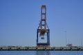 ROTTERDAM, THE NETHERLANDS - New container terminal with a very large container ship and in the foreground a smaller inland Royalty Free Stock Photo