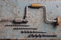 Rotterdam, Netherlands - 11-11-2022: Vintage brace or hand drill with extra drills flat lay