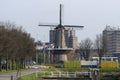 Rotterdam The Netherlands Wind Korenmolen de Distilleerketel windmill, malt mill, on the historical Delfshaven.