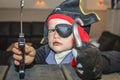 Little boy dressed as a pirate.