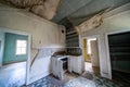 The rotting and decaying interior of an old kitchen in an abandoned home in Bannack Ghost Town. Ceiling is collapsing Royalty Free Stock Photo