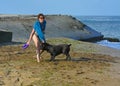 The Rottweiler dog and her mistress in the water