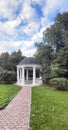 Rotunda in the park. Antique gazebo in the autumn Park.