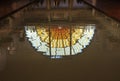 Stained glass window reflected in swimming pool at La Piscine Museum of Art and Industry, Roubaix France