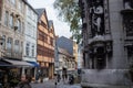 Rouen. Old and tilted houses at Rue Eau de Robec on a rainy day. Rue Eau-de-Robec is one of the main tourist streets of