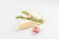 Rougette cheese with fresh rosemary and garlic isolated on white background Royalty Free Stock Photo