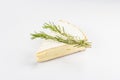 Rougette cheese with fresh rosemary isolated on white background Royalty Free Stock Photo