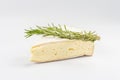 Rougette cheese with fresh rosemary isolated on white background Royalty Free Stock Photo