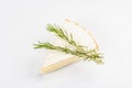 Rougette cheese with fresh rosemary isolated on white background Royalty Free Stock Photo