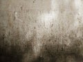 Rough, aged, and decayed concrete surface with dark stains Royalty Free Stock Photo