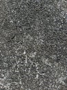 Rough asphalt texture with tiny pebbles, ideal for background, texture design, or industrial material. Royalty Free Stock Photo