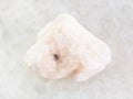 rough Barite stone on white marble