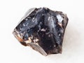 rough black Flint stone on white