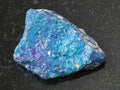 rough blue Chalcopyrite stone on dark background