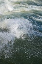 Rough blue green ocean wave with white swell and droplets Royalty Free Stock Photo