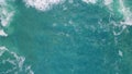 Rough blue ocean splashing foaming on stone cliff aerial view. Coastal scenery. Royalty Free Stock Photo