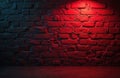 Rough brick wall lit by red neon light, creating dramatic shadows. The floor also reflects the red glow. Empty indoor space, Royalty Free Stock Photo