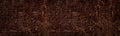 Rough bronze color surface widescreen background. Dark cement plaster wide texture Royalty Free Stock Photo