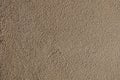 Rough bumpy brown concrete plaster. Royalty Free Stock Photo