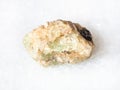 rough chrysoberyl (green beryl) crystal on white